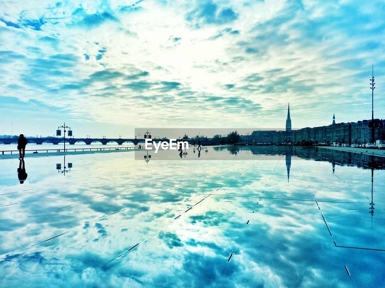 Reflection of cloudy sky on miroir d eau
