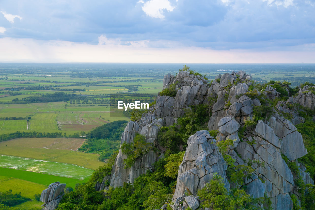 scenic view of sea and mountains against sky