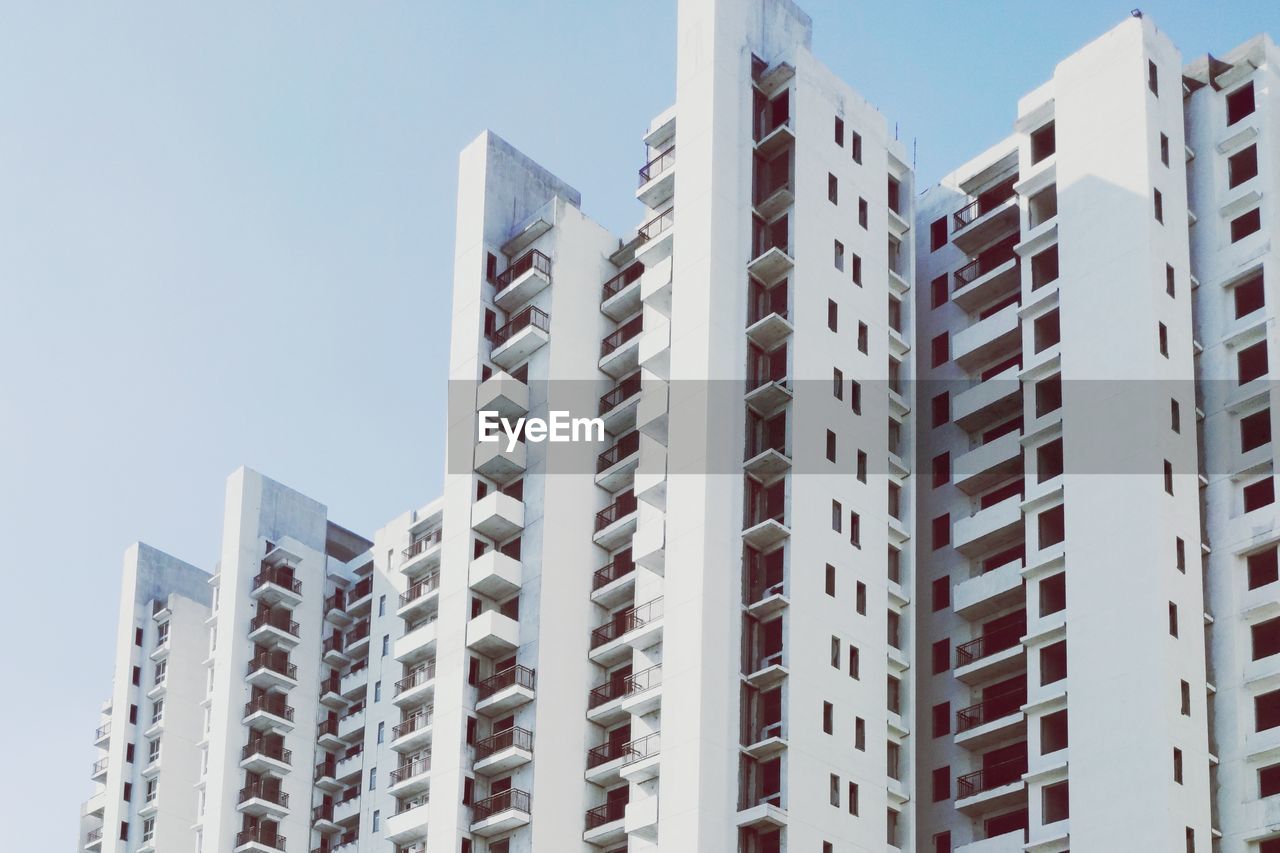 Low angle view of modern buildings against sky