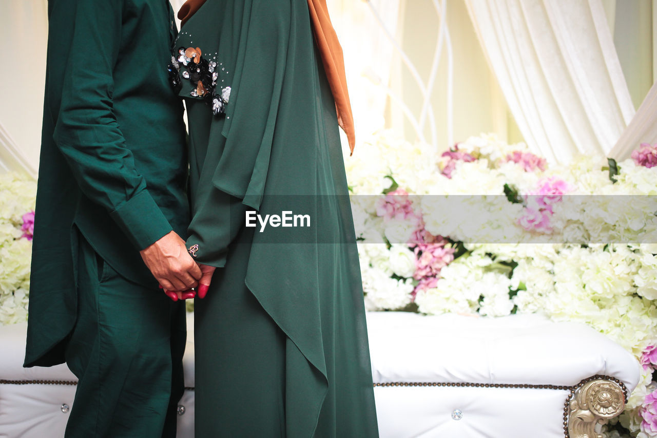 Couple hugging on their wedding. bride and groom holding hands.