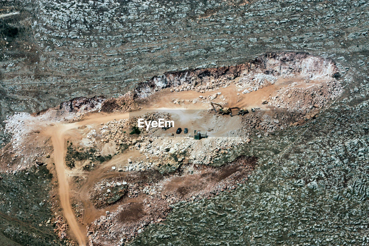 HIGH ANGLE VIEW OF SUNLIGHT FALLING ON ROCK