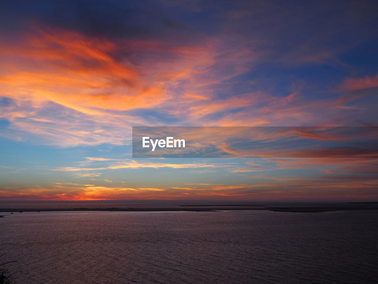 Scenic shot of calm sea at sunset