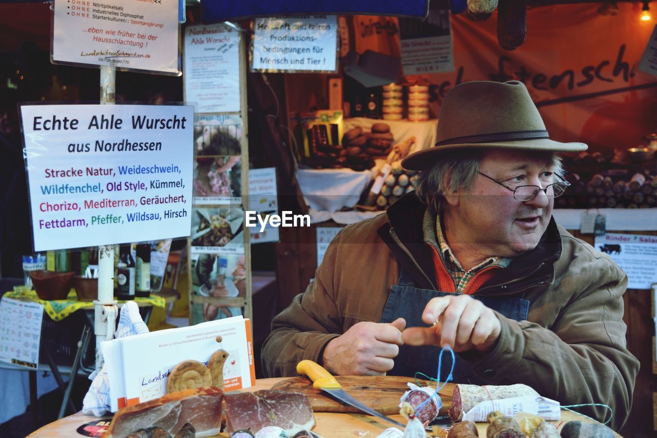 Man selling meat at market