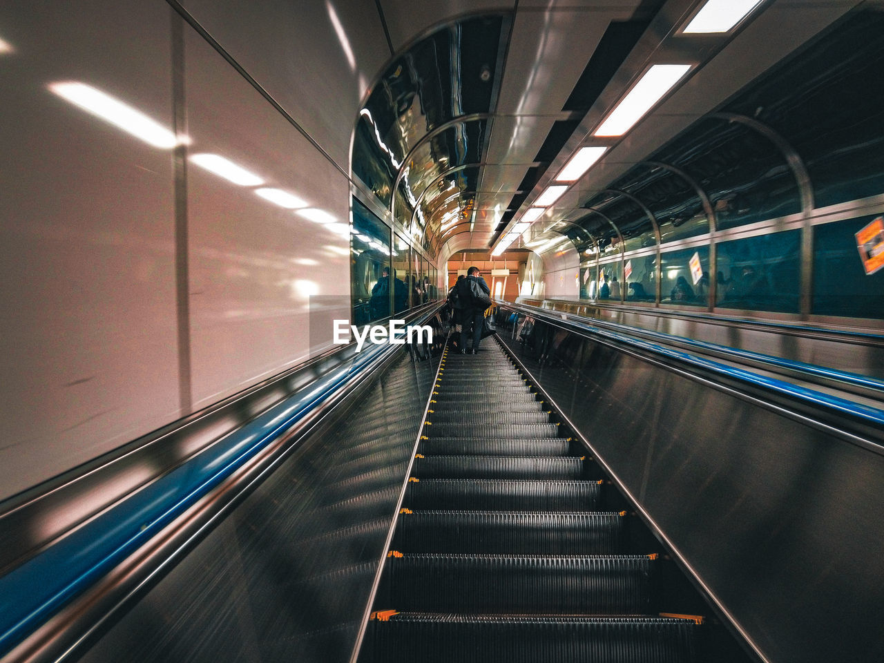 Illuminated escalator in subway station