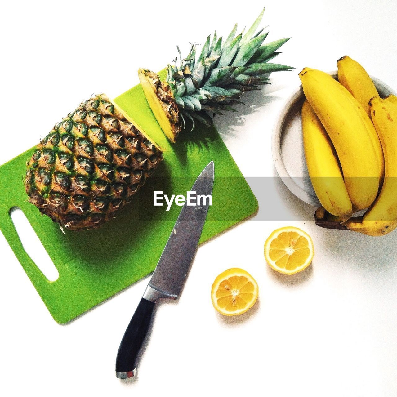 High angle view of sliced pineapple on cutting board