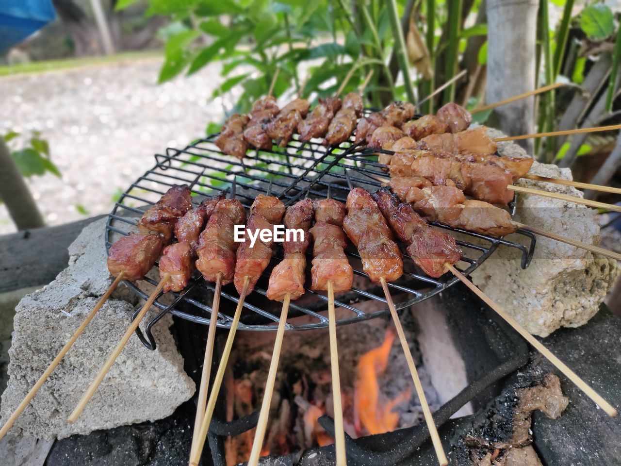 High angle view of meat on barbecue grill