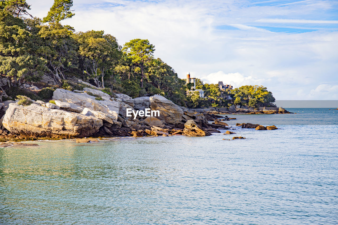 SCENIC VIEW OF SEA AGAINST ROCK FORMATION