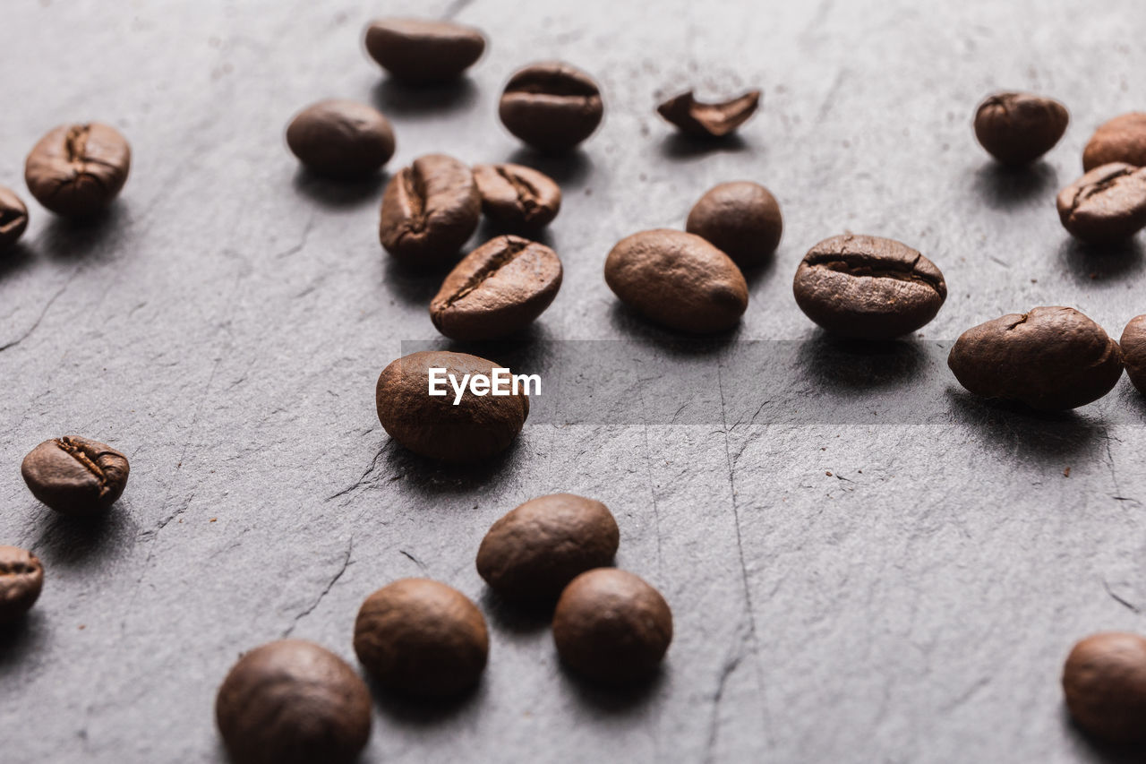 Closeup of coffee beans with focus on one