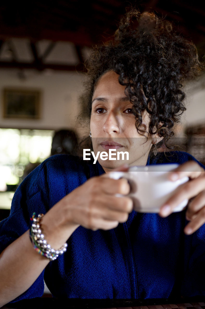 Relaxed woman drinking a cup of coffee,