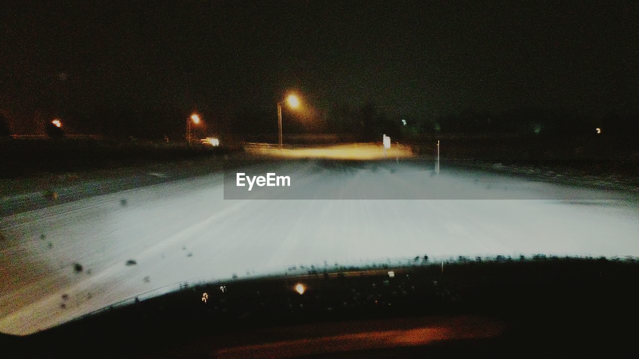 VIEW OF ROAD AT NIGHT