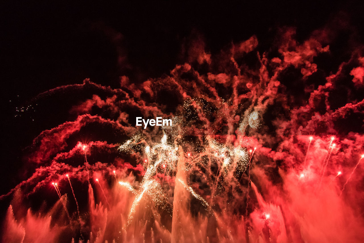 LOW ANGLE VIEW OF FIREWORK DISPLAY