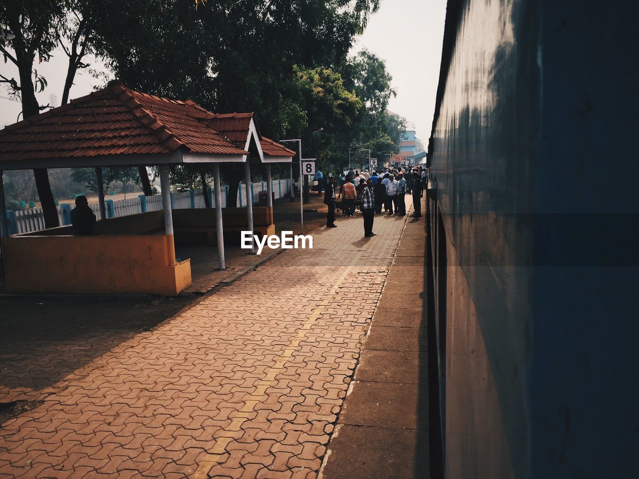 PEOPLE WALKING IN FRONT OF BUILDINGS