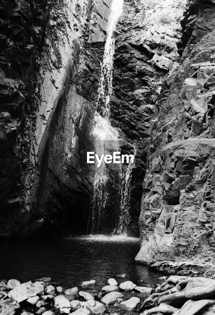 WATER FLOWING ON ROCKS