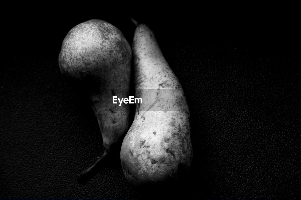 Close-up of pears on black background