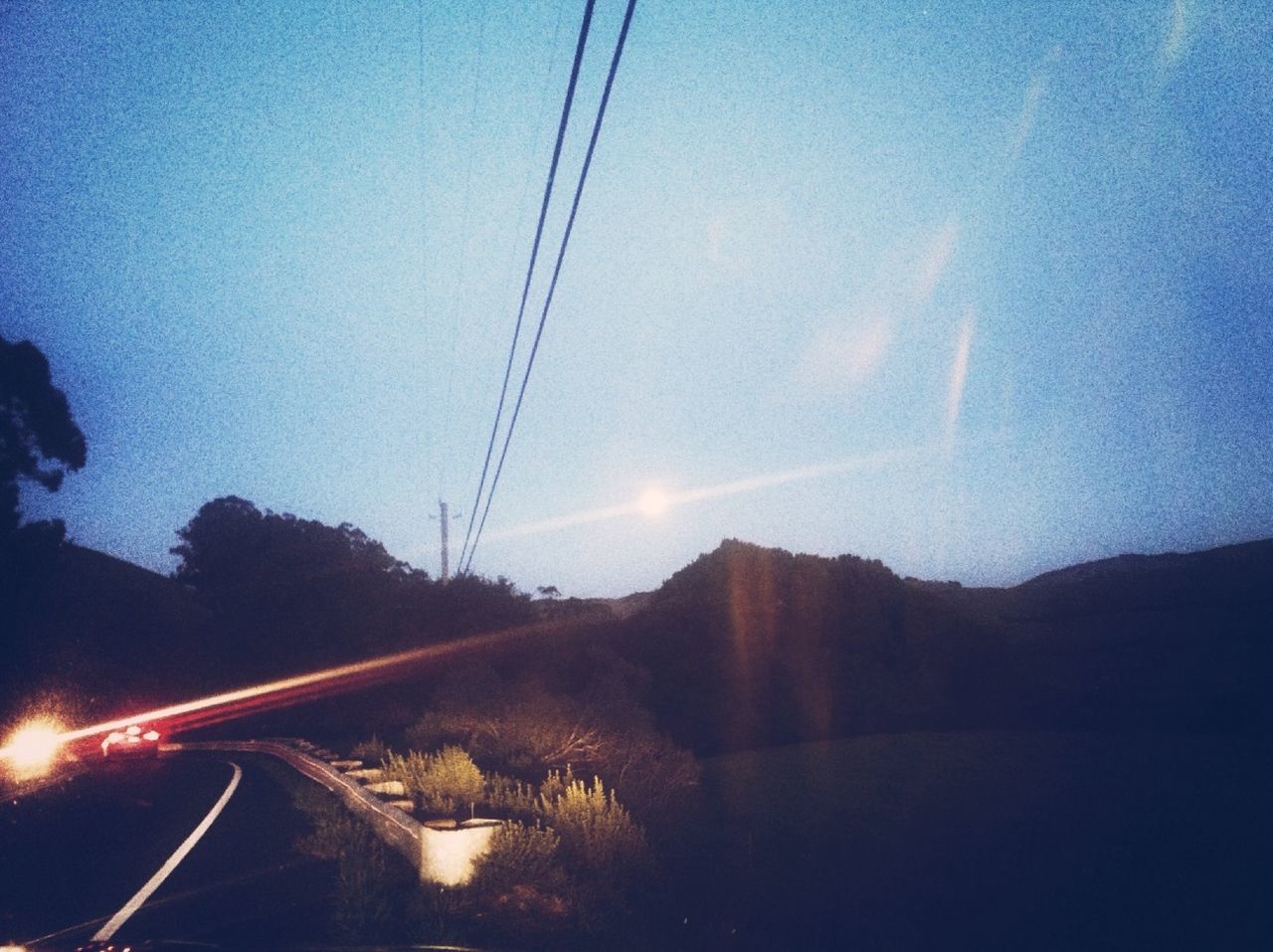 View of silhouette trees against clear sky