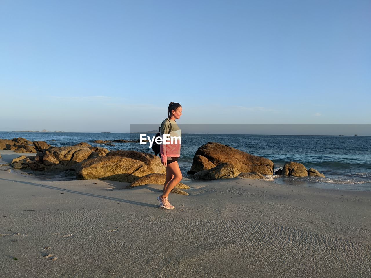 Woman walking on beach