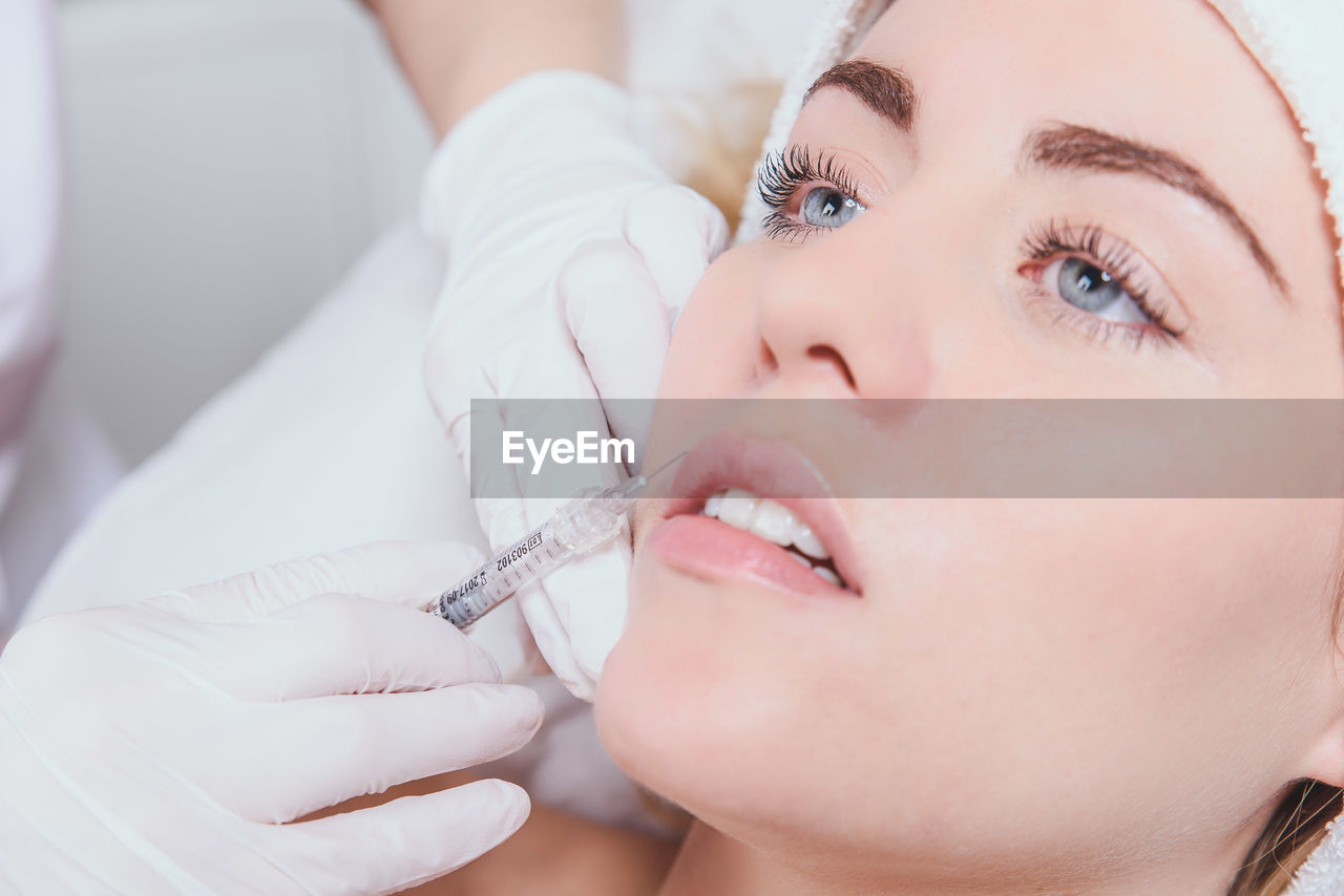 Close-up of woman receiving botox injection