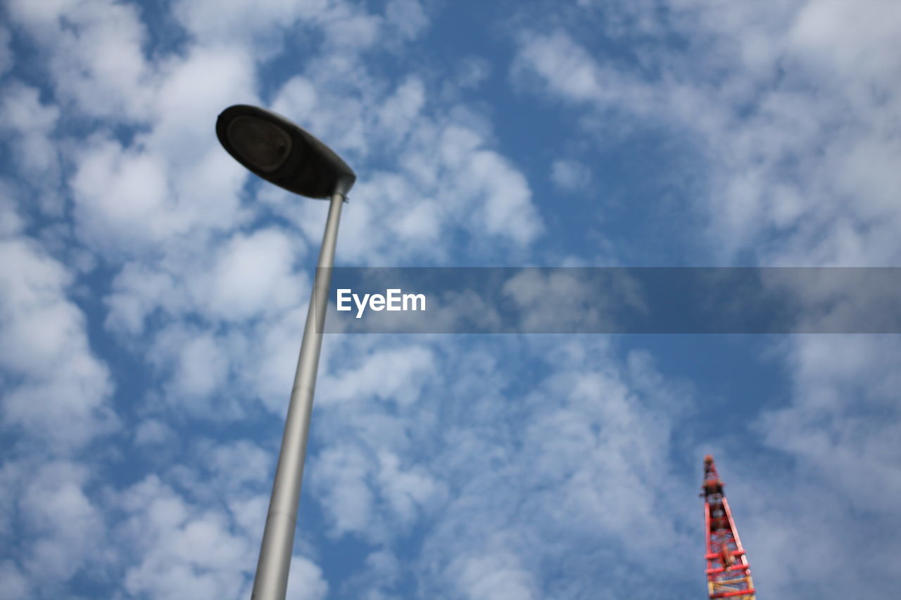 LOW ANGLE VIEW OF FLOODLIGHT AGAINST SKY