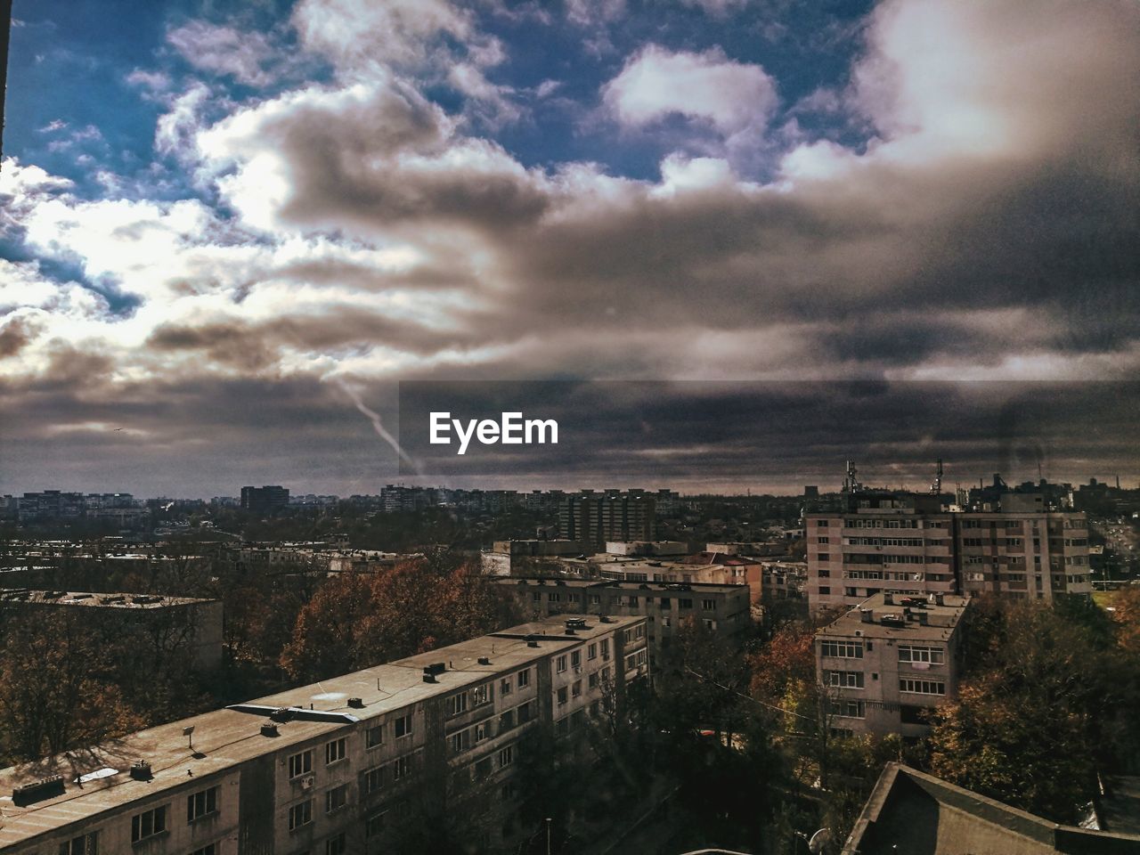 High angle view of buildings in city against sky