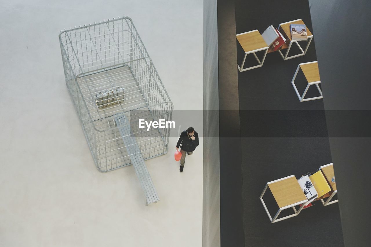 HIGH ANGLE VIEW OF SHOPPING CART IN OFFICE