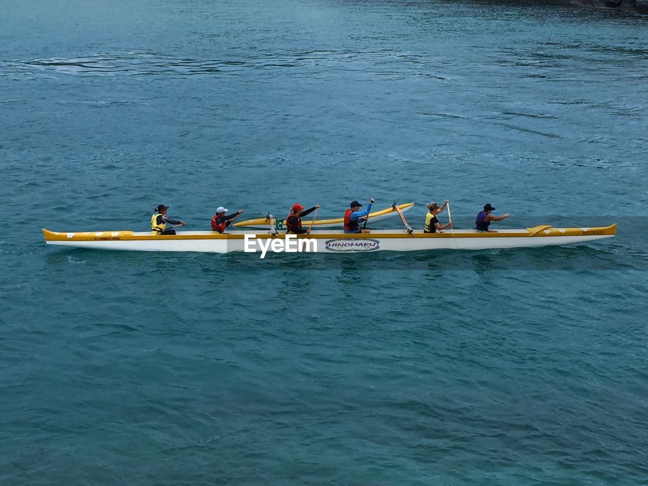 GROUP OF PEOPLE IN BOAT AT RIVER