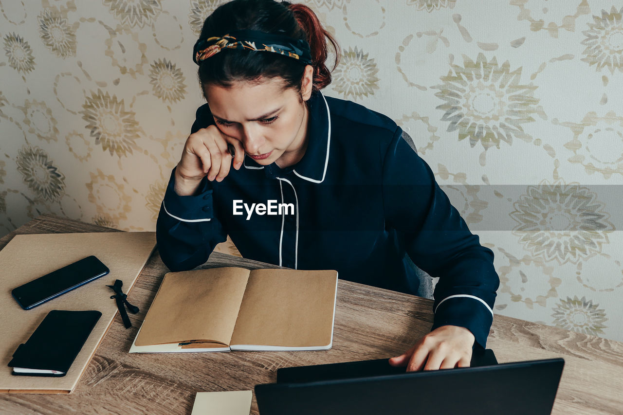 Office work, women site in the table 