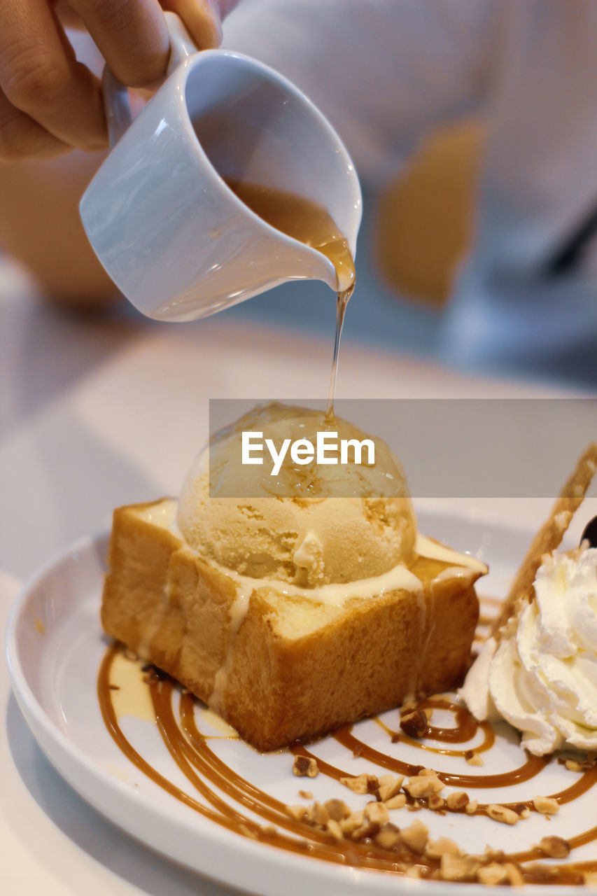 Close-up of ice cream cone in plate