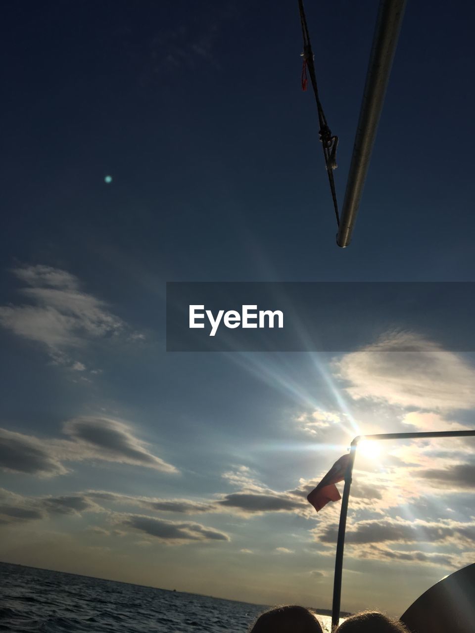 LOW ANGLE VIEW OF SILHOUETTE FLAG AGAINST SKY AT SUNSET