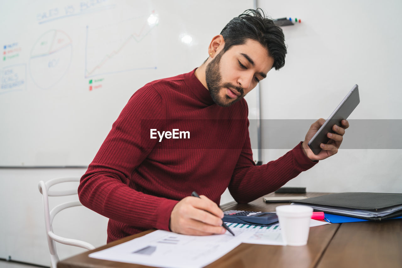 Young business man working in office