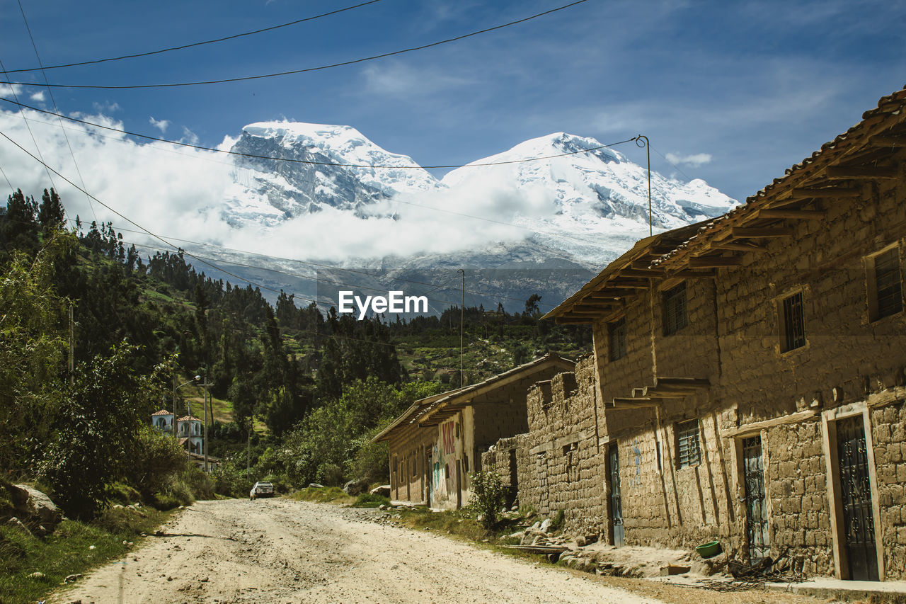 Scenic view of the road to snowcapped huascaran against sky