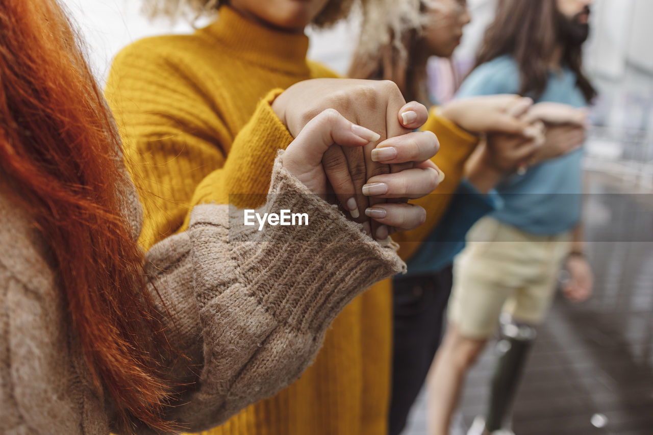 Activists holding hands with each other