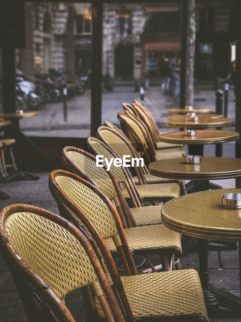 Wicker chairs and tables at outdoor restaurant