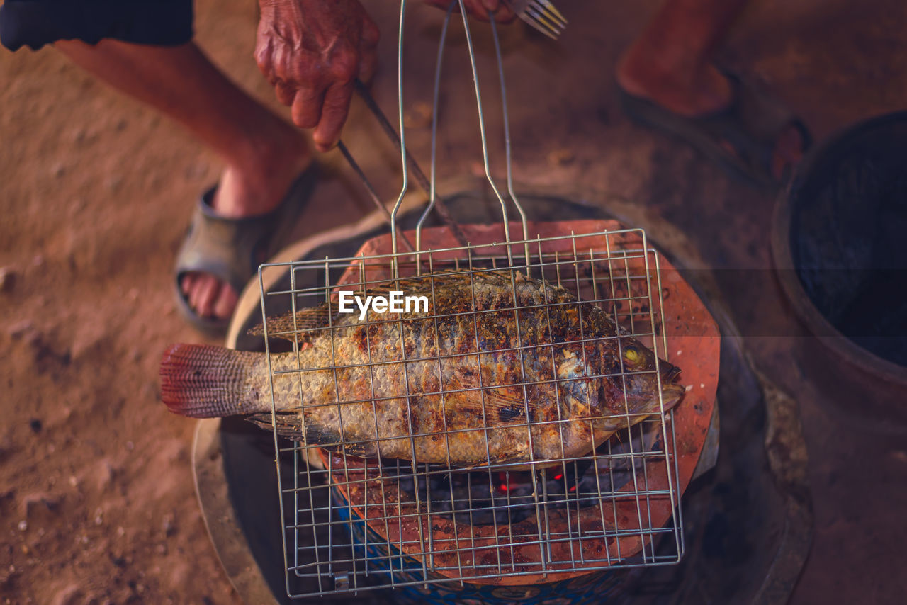 food, hand, food and drink, one person, freshness, meat, barbecue, adult, cooking, holding, barbecue grill, men, animal, outdoors, grilling, grilled, close-up, occupation, healthy eating
