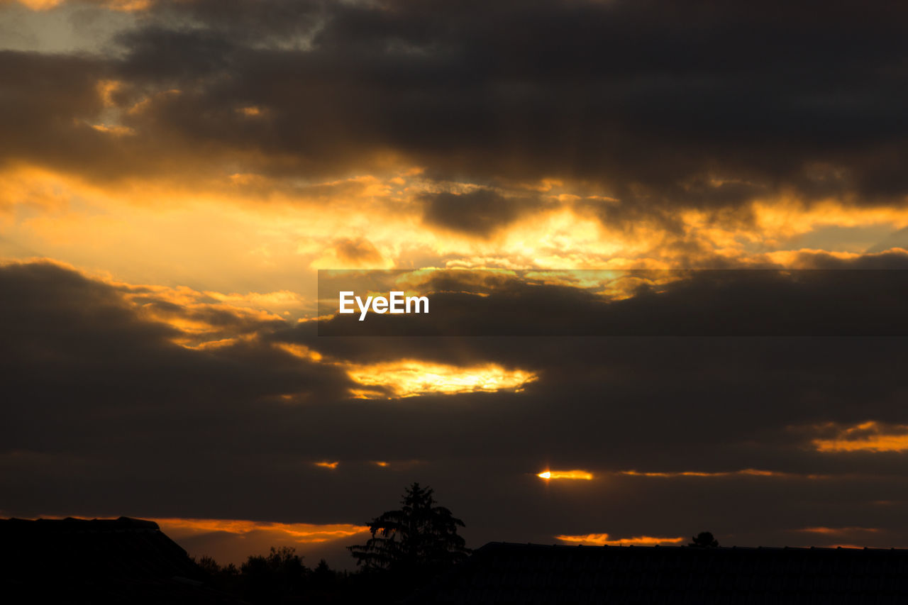 Low angle view of dramatic sky during sunset