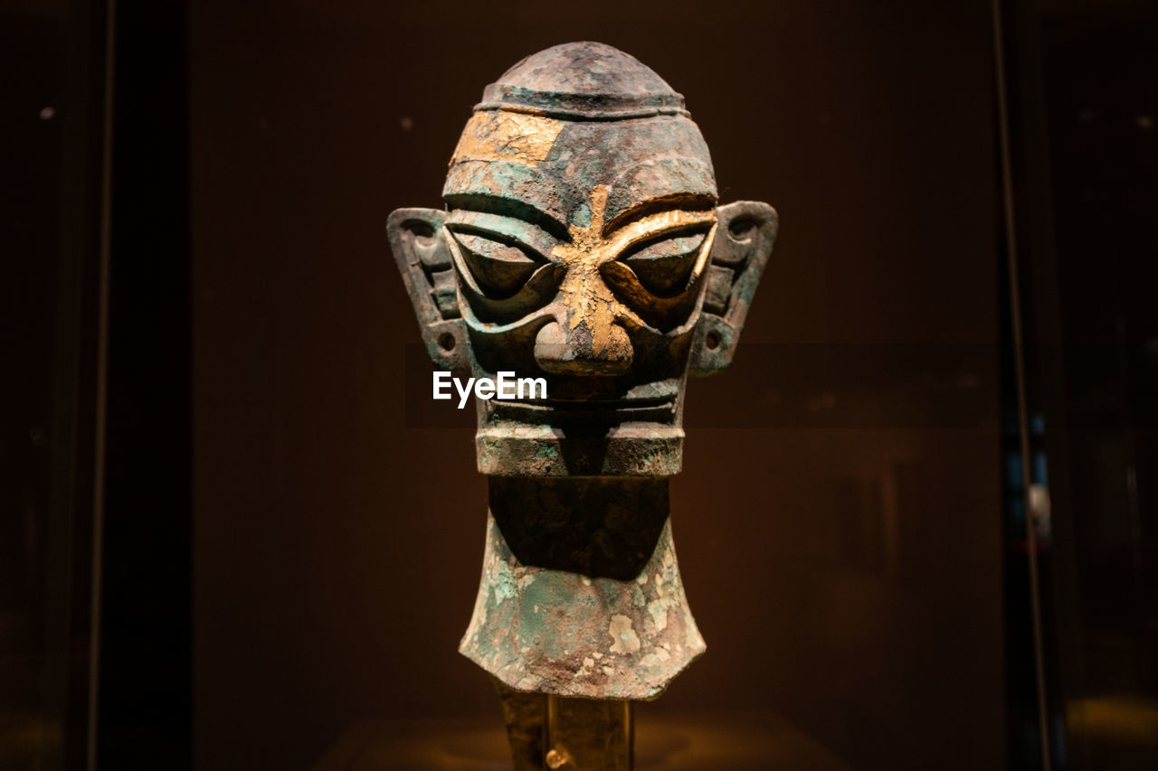 A bronze head from the sanxingdui archaeological site of bronze age in guanghan, china.