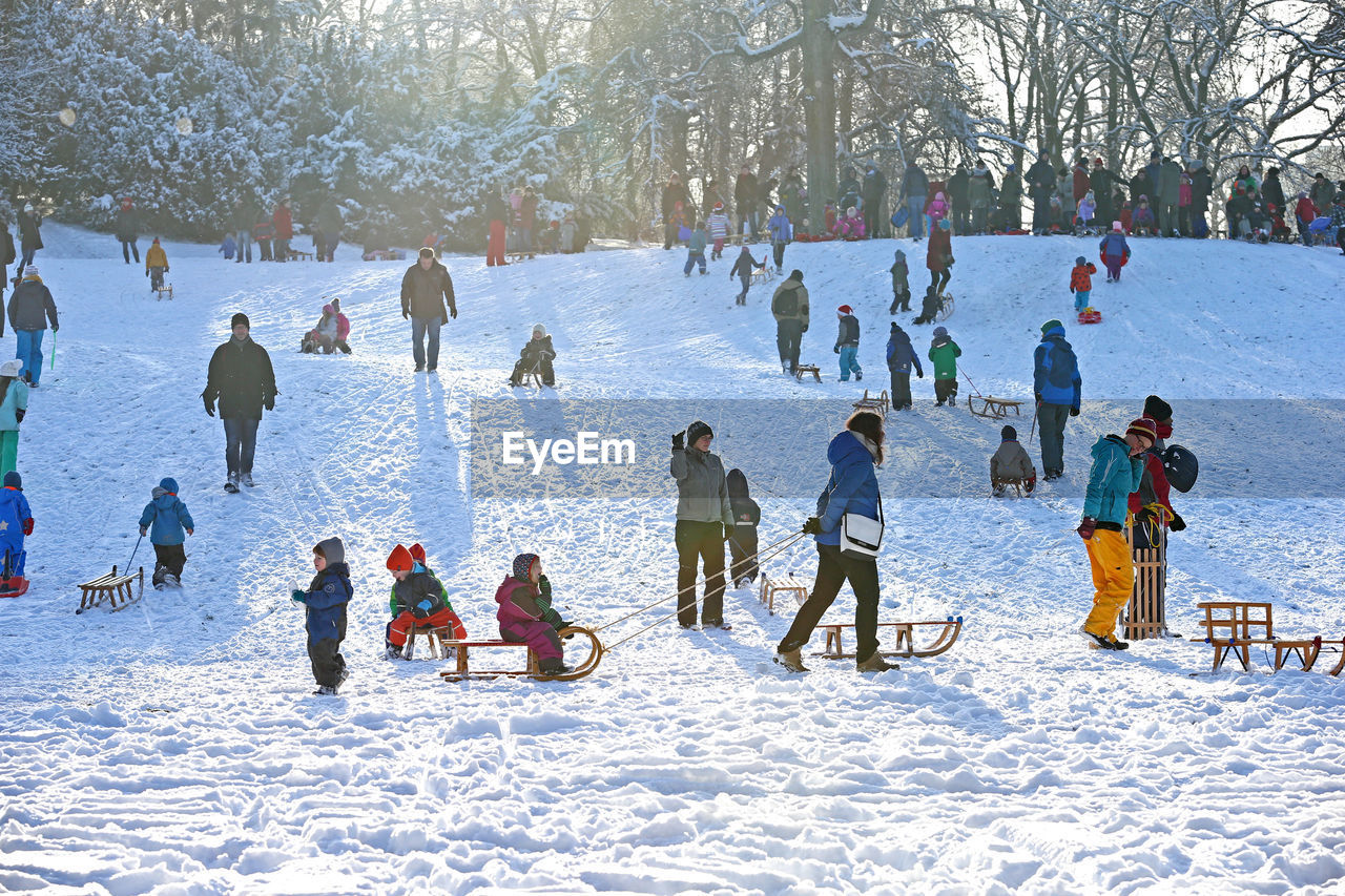 People on snow covered field