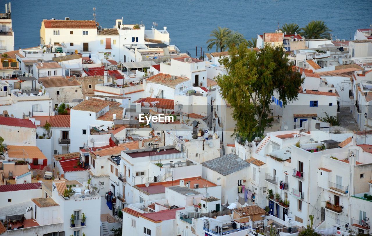 High angle view of townscape by sea