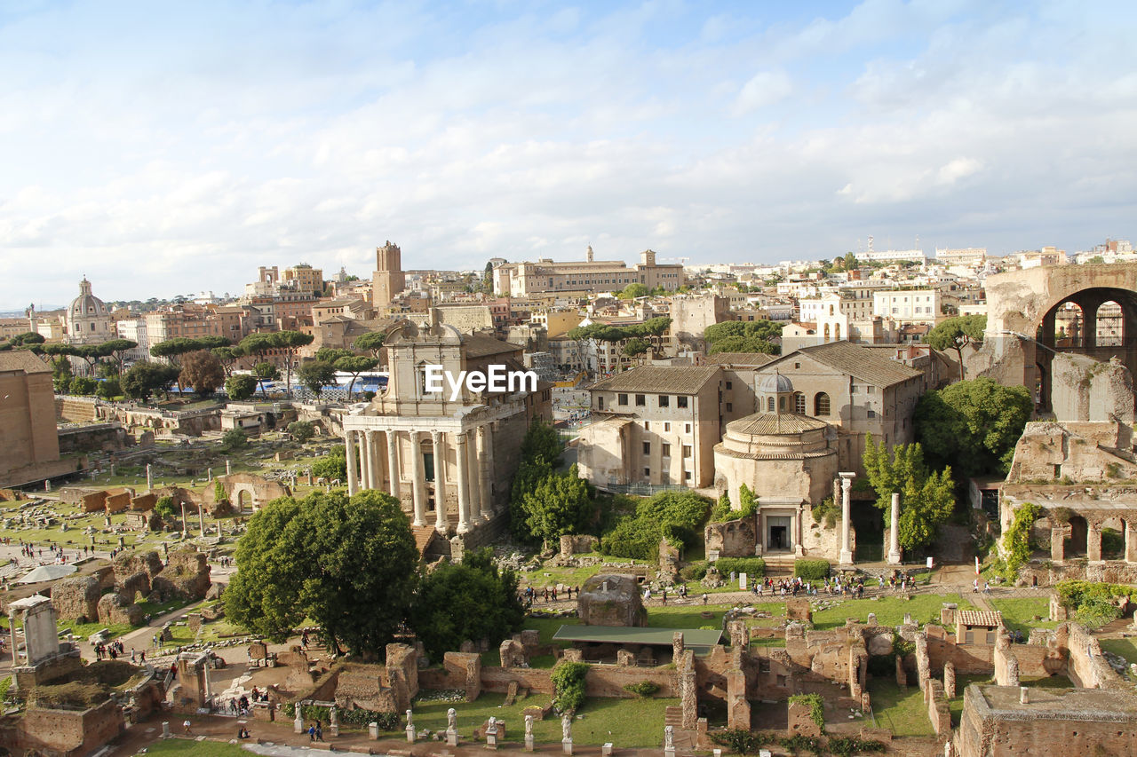 Aerial panoramic cityscape view of the roman forum during sunset in rome, italy