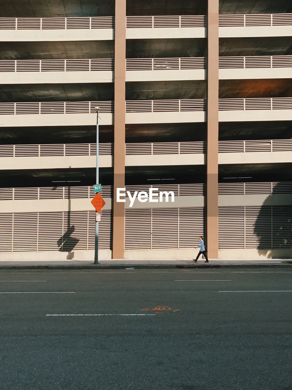 MAN PLAYING WITH BUILDING