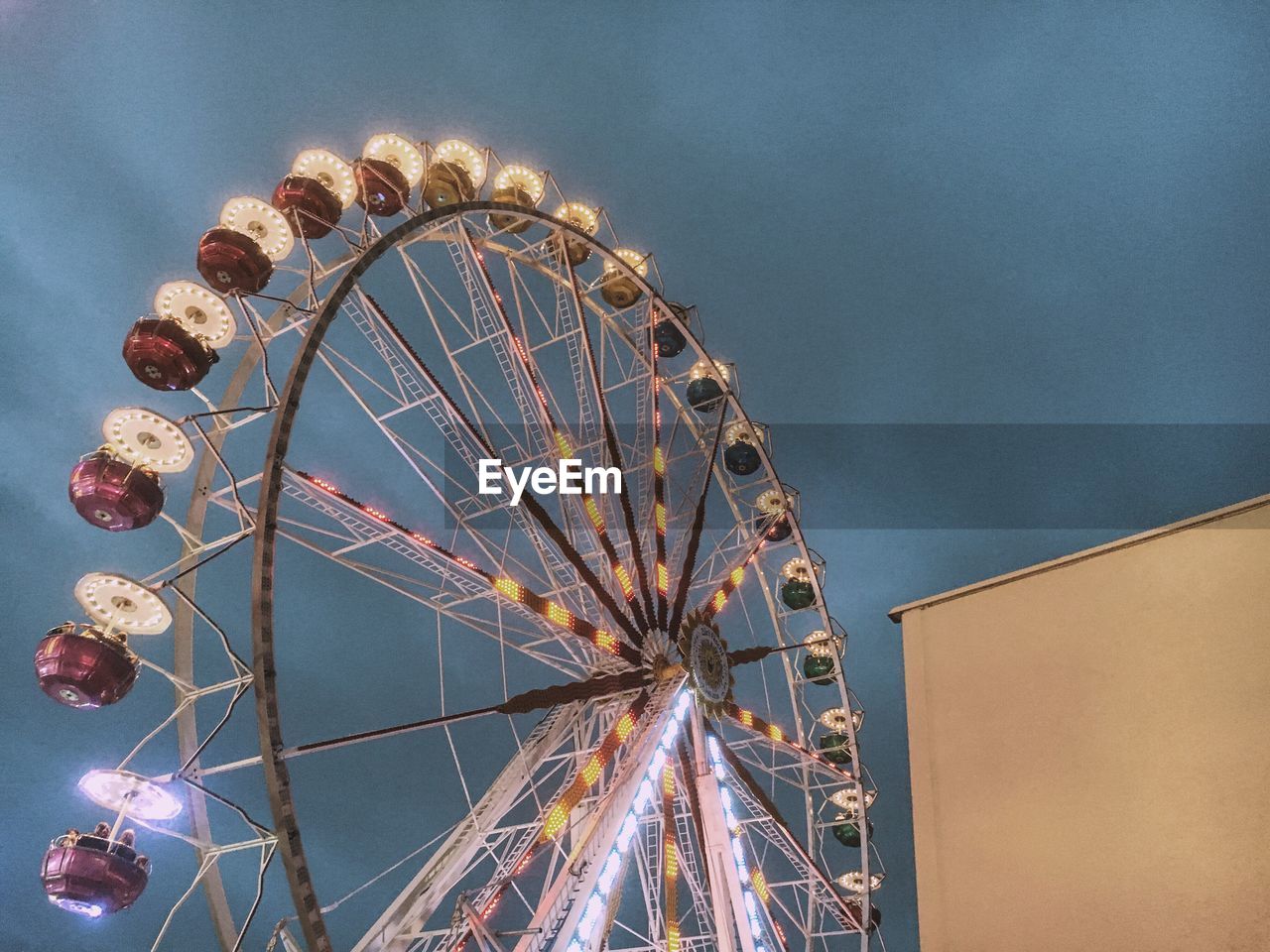 Low angle view of ferris wheel against sky