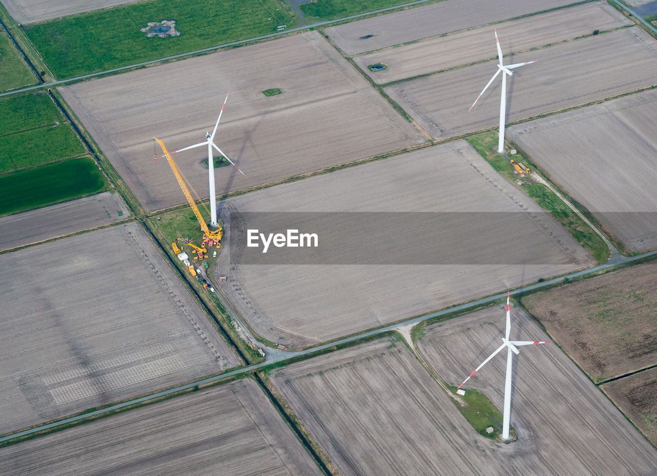 High angle view of wind turbines on field