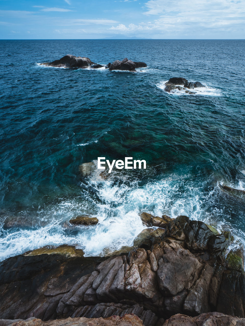 water, sea, rock, land, ocean, beauty in nature, scenics - nature, beach, body of water, sky, shore, nature, coast, wave, motion, wind wave, horizon, terrain, no people, horizon over water, cliff, day, rock formation, outdoors, cove, sports, blue, travel destinations, tranquility, travel, tranquil scene, water sports, coastline, idyllic, cloud, islet, non-urban scene, bay