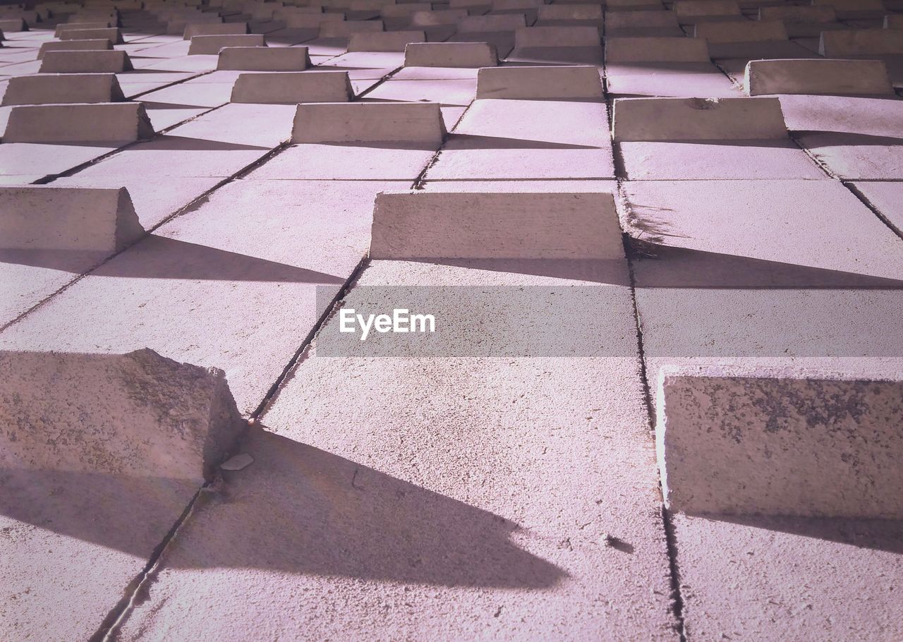 HIGH ANGLE VIEW OF COBBLESTONE