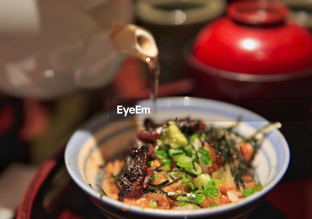 High angle view of grilled eel in bowl on table