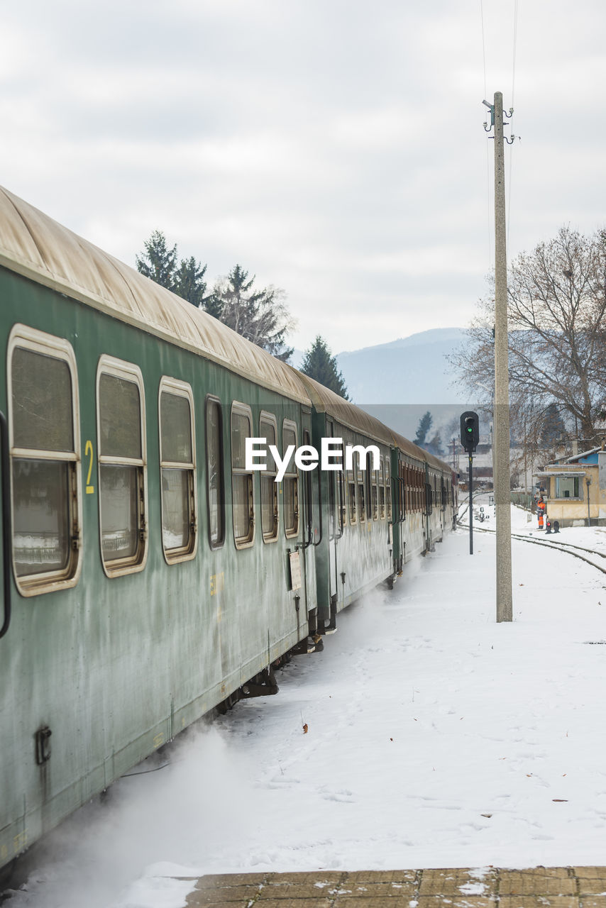 TRAIN ON SNOW COVERED LANDSCAPE