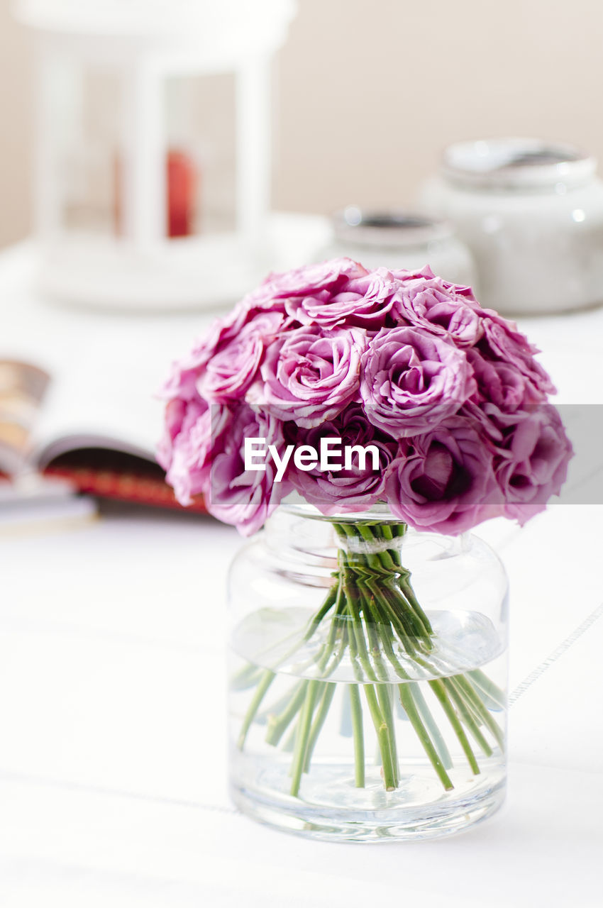 Close-up of flower vase on table