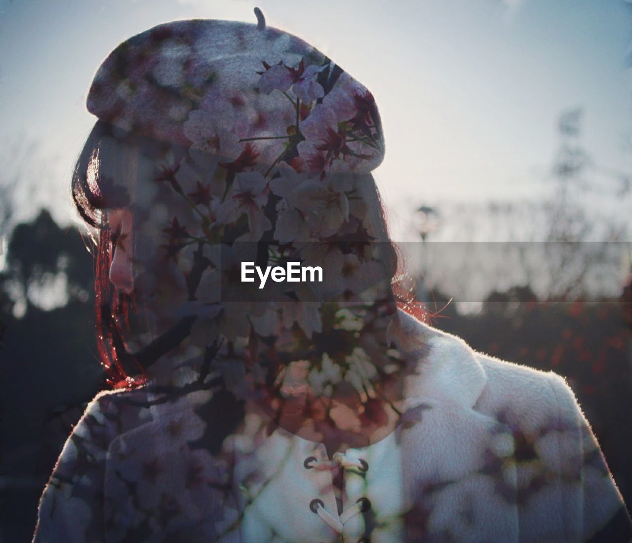 Multiple exposure of flowering plants and woman