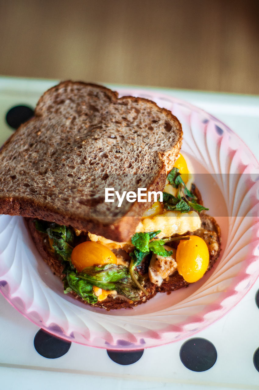 Close-up of breakfast sandwich served on table