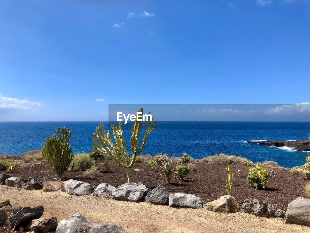 Scenic view of sea against blue sky