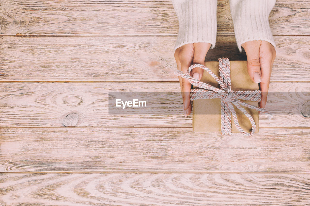 LOW SECTION OF WOMAN TIED UP WOODEN WOOD